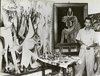 Lam in his studio in Havana, with left: Le présent éternel [Hommage a AAlejandro Garcia Caturla], 1944, oil on canvas, 215.9 x 196.9 cm. right: Le sorcier de l'ocean [Alafi Inca/Ogun ferraille], 1947, oil on canvas, 107 x 85.5 cm.