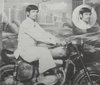 Guman Singh astride a traveling studio's motorbike
