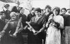 Women holding  bombs at a British ammunition dump, Italy, World War I