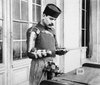 An Amputee at l' Hopital du Grand-Palais attaches a tool to his prosthetic device, Paris, March-April 1919