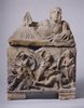 Cinerary urn with Greeks fighting Amazons on the box and woman with fan on the lid